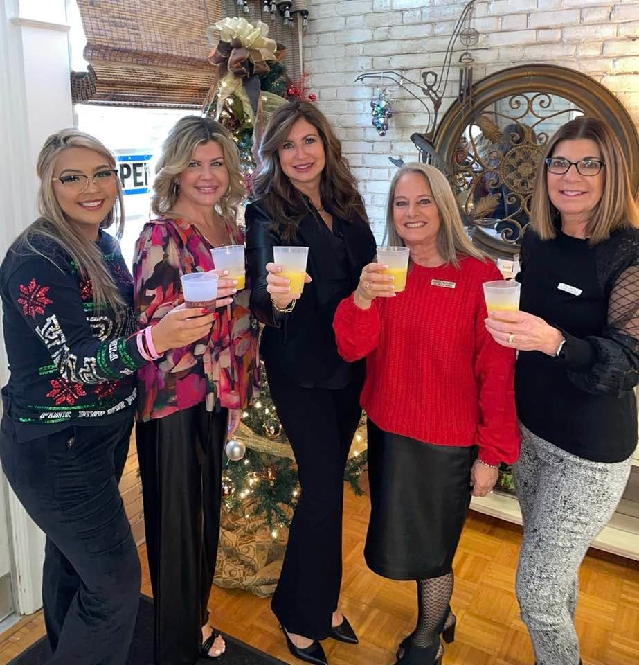 Team members and friends at a La Bella Donna customer appreciation event